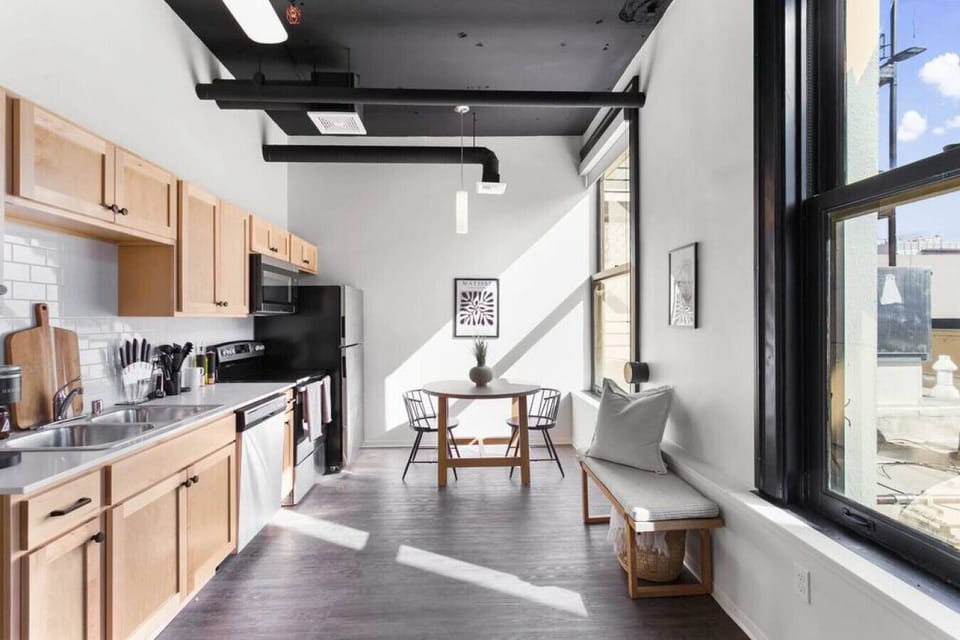 Sleek, fully stocked kitchen with high-end appliances—perfect for home-cooked meals or morning coffee.