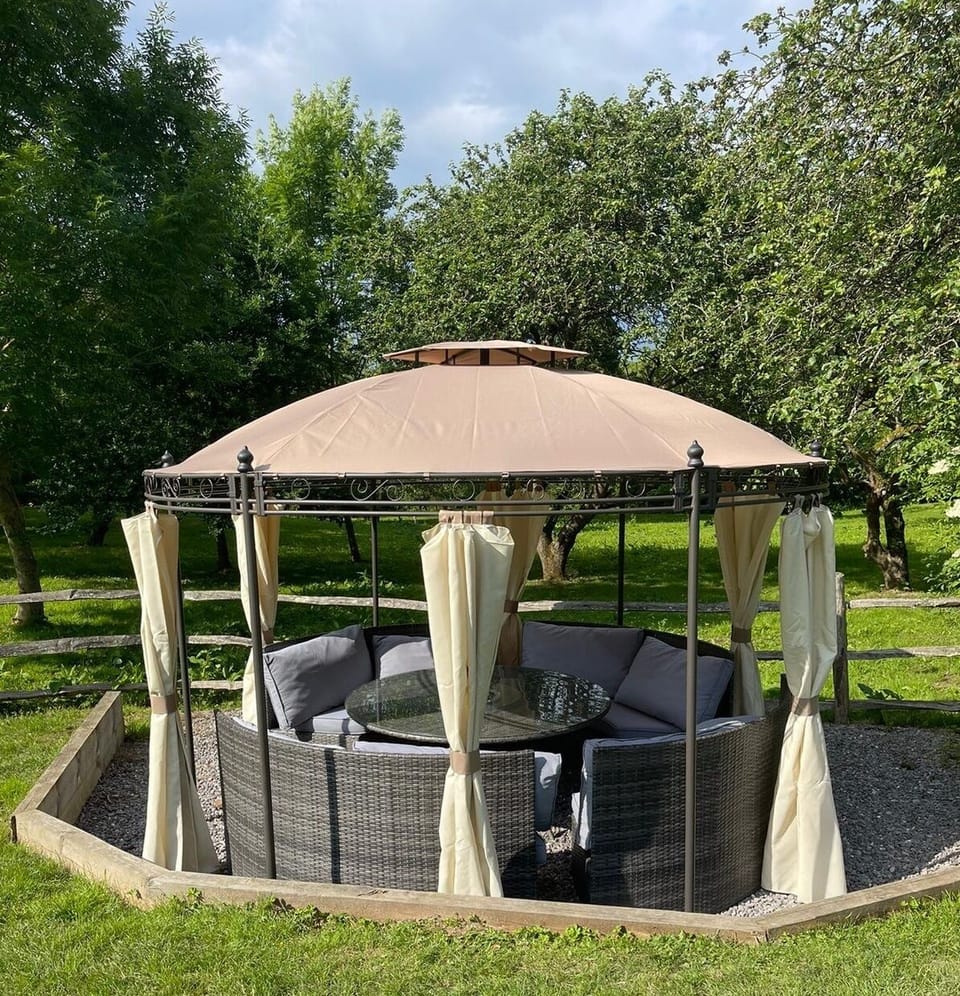 Covered seating area at the bottom of the main lawn. Summer configuration