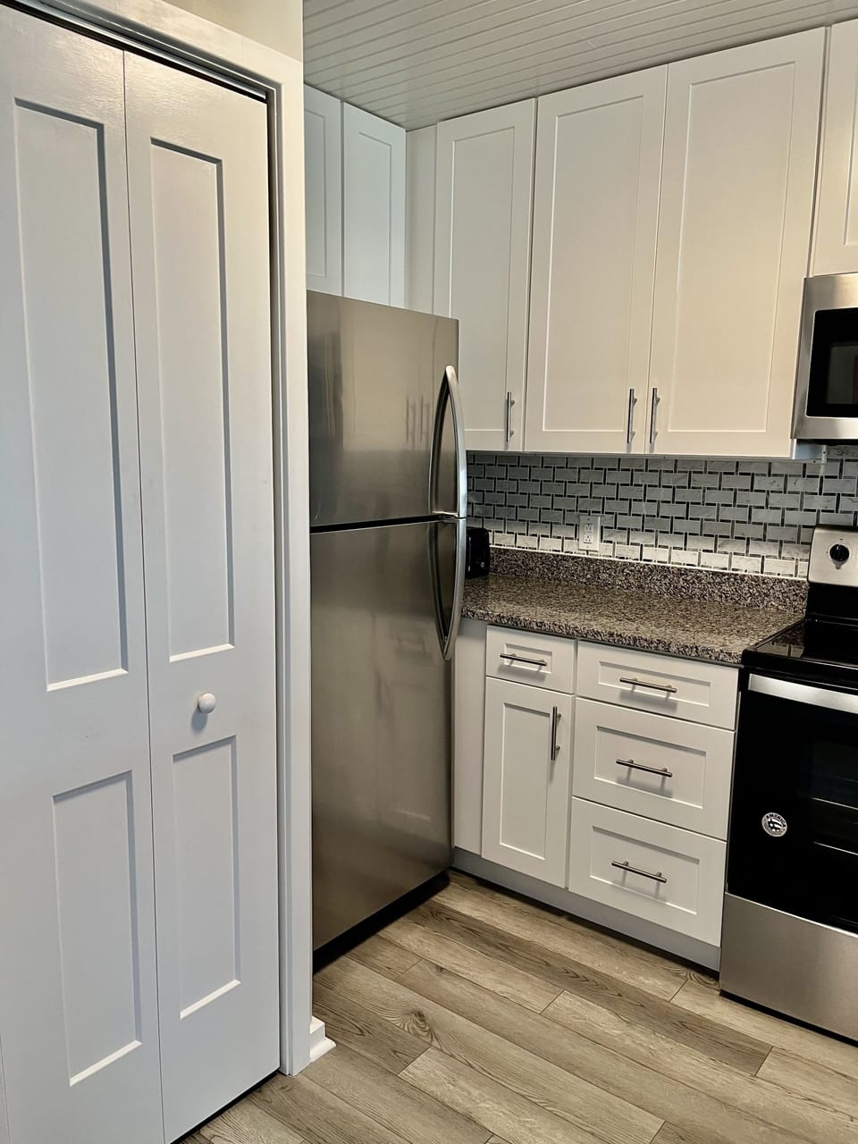 Inside the closet doors in kitchen are the stackable washer and dryer.  Great for washing bathing suits and towels as needed.