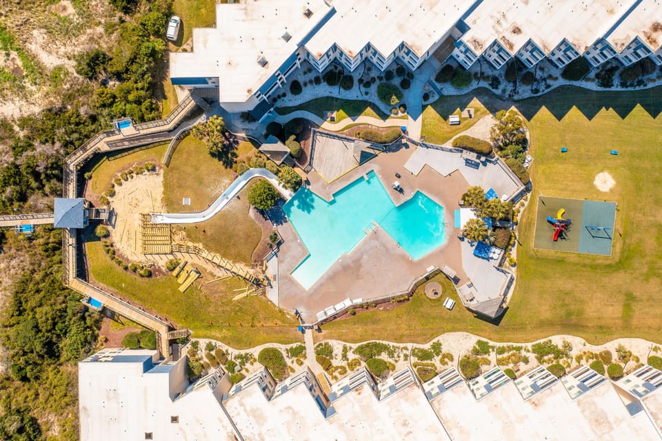 APATB waterslide and amazing pool! There is a shallow end for relaxing and for little ones, and a deep end for swimming and playing the day away.