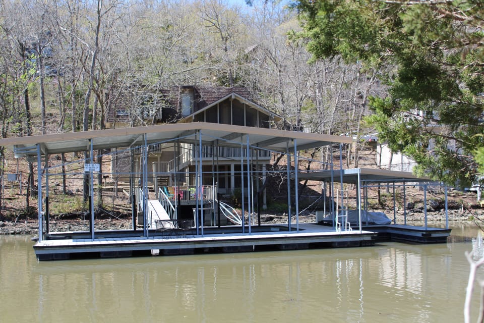 Large dock with 40x16 boat slip.  Enjoy swimming, fishing or sun tanning in cove