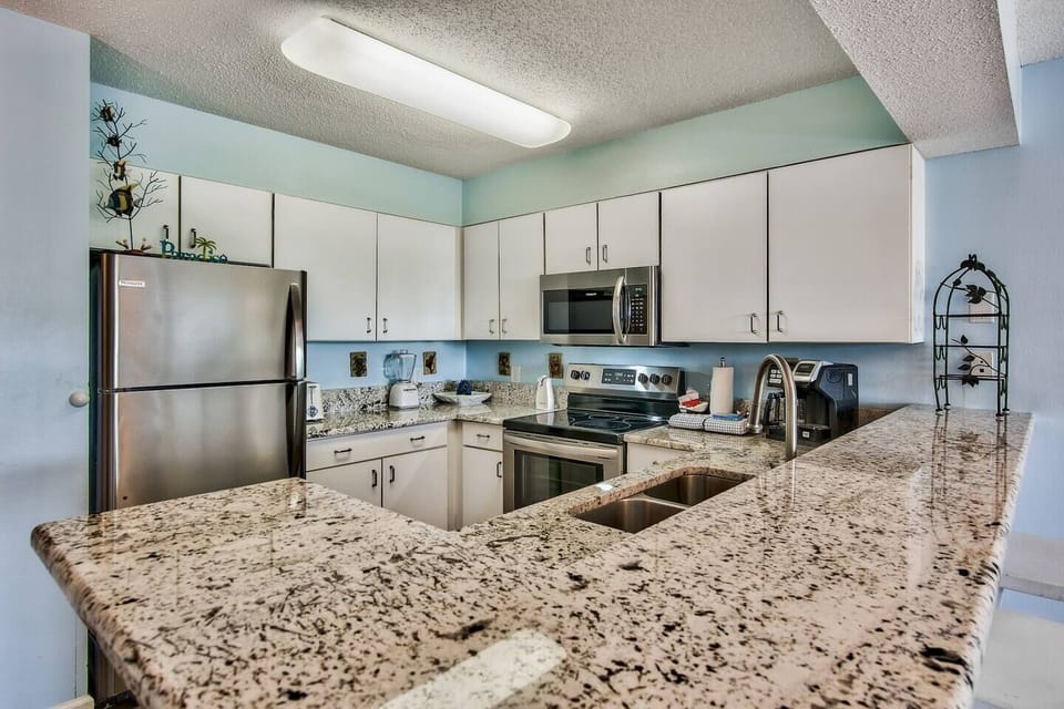 Spacious kitchen with beautiful granite counter top