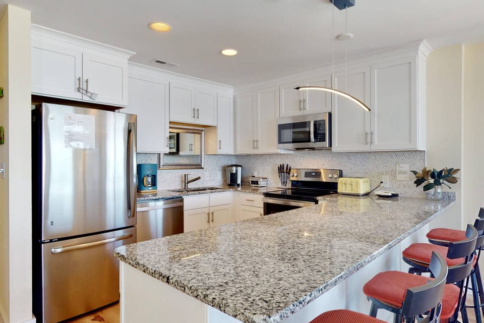 Spacious kitchen counter with bar top seating