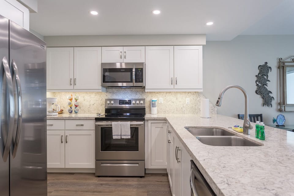 Kitchen has stainless steel appliances, including a dishwasher!