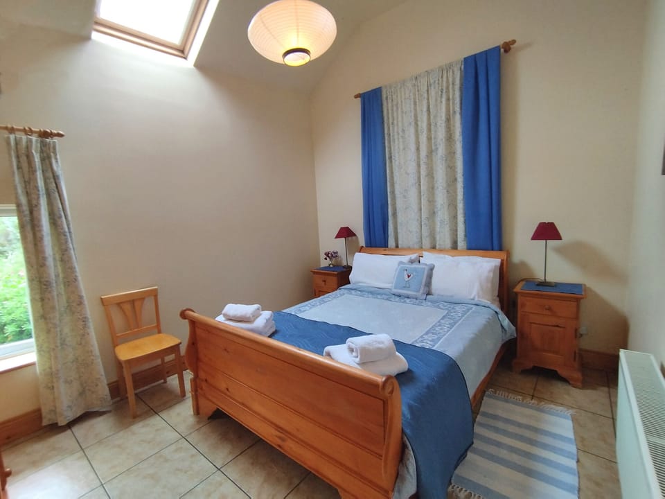 Bedroom, next to Bathroom has 5ft Sleigh bed, wardrobe & drawers & garden view 