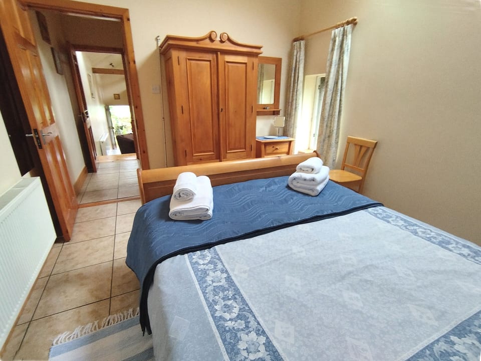 Bedroom view towards Bathroom corridor, living room and front door