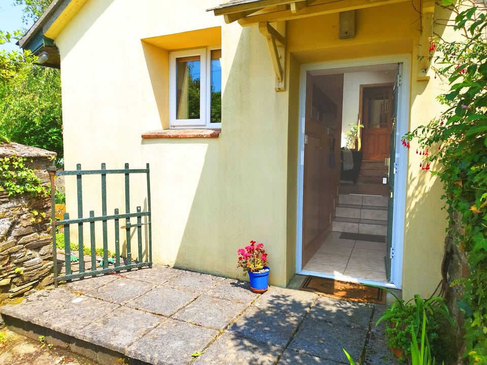 Front door opens to private patio and gate leads to courtyard garden