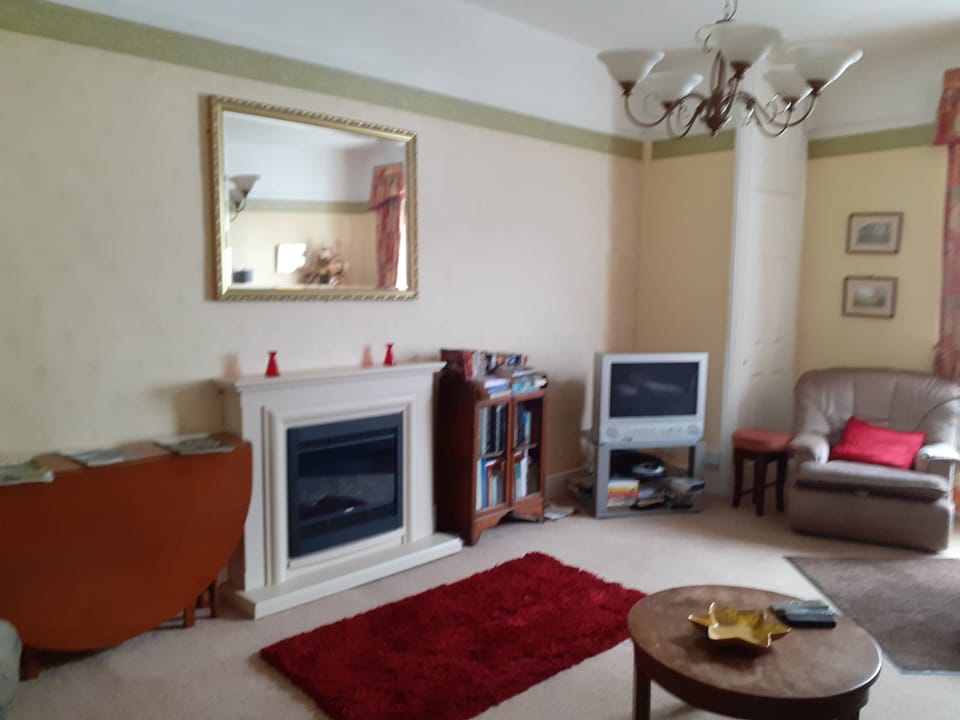 Apartment | Living room | 30-inch TV with digital channels