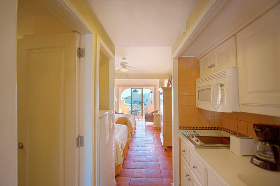 Fridge, microwave, stovetop, coffee/tea maker