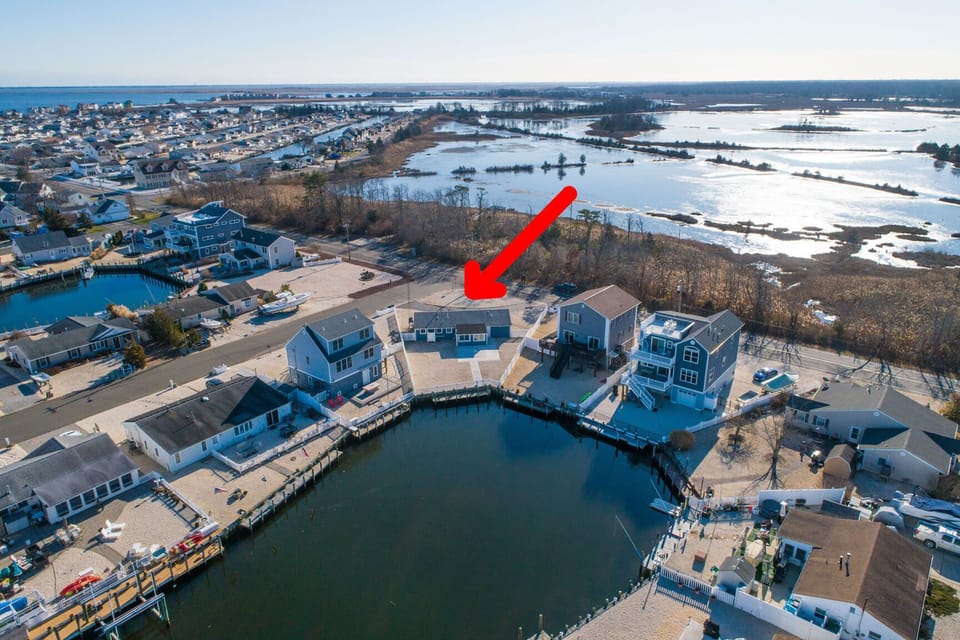 Drone view of house from over lagoon