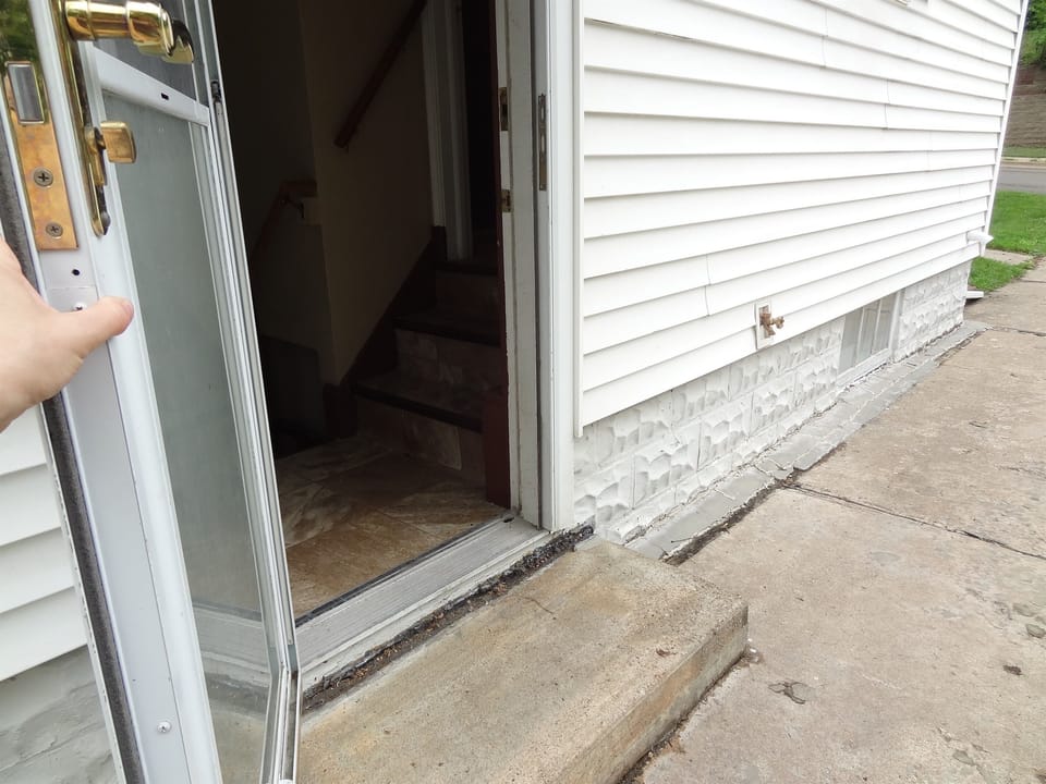 Entrance using side door. 1 step to landing then 3 to kitchen