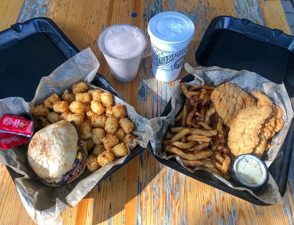 Just down the street, you'll find The Pharmacy, a Nashville hotspot for mouthwatering burgers and a vibrant beer garden experience.