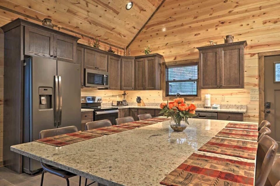 A spacious dining table serves as the centerpiece of this inviting gathering space.
