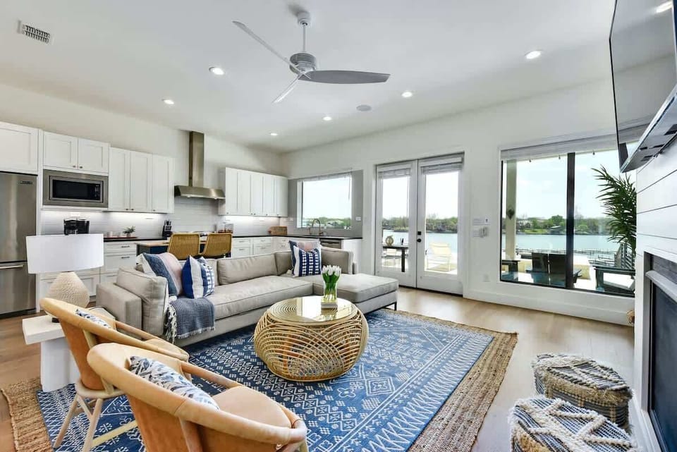 The living area opens to the kitchen and has beautiful views of the lake!