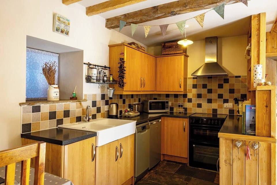 Natural light fills this well-organized kitchen, making meal prep a joy.

