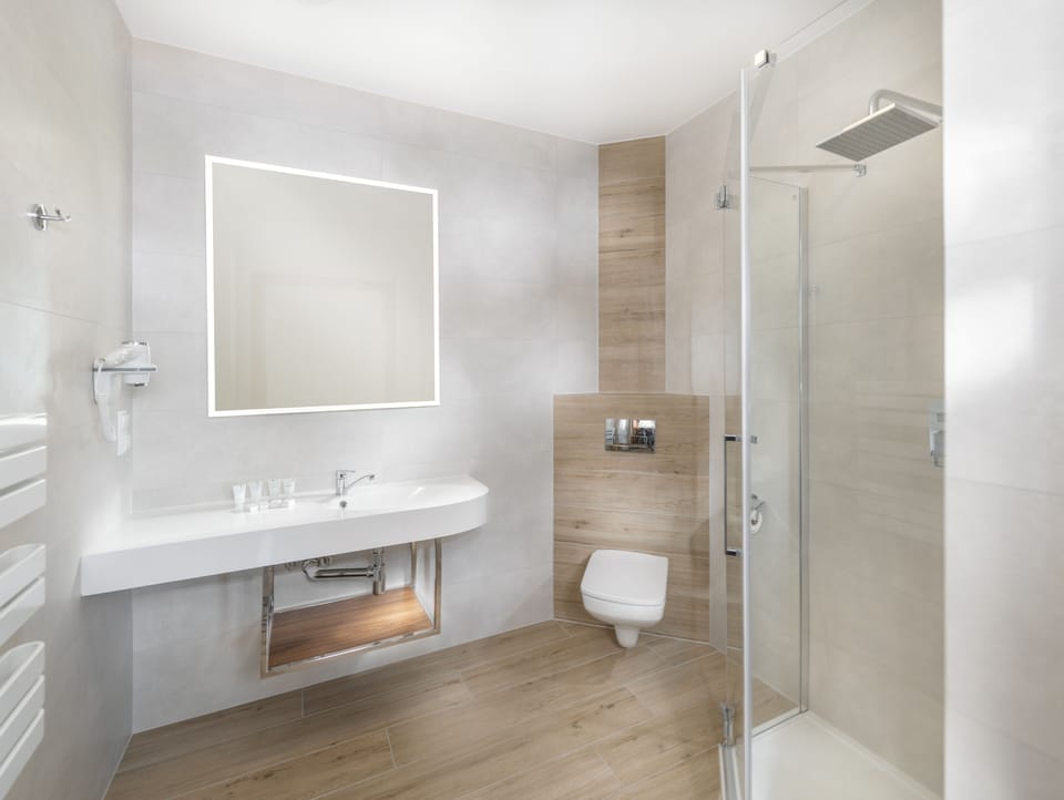 Shower, rainfall showerhead, hair dryer, towels
