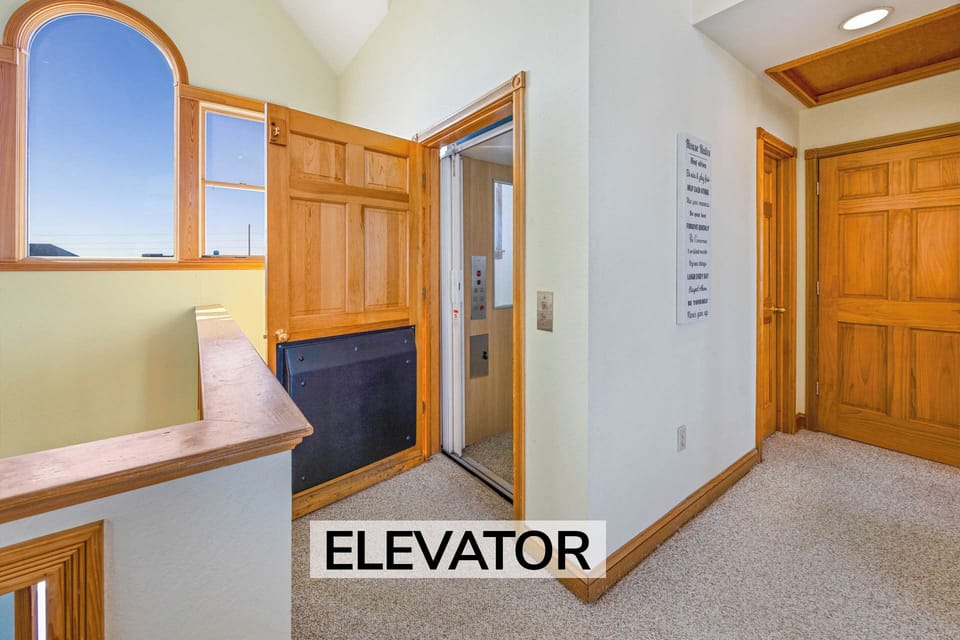 Surf or Sound Realty - 942 - Shore To Please - Elevator - Label