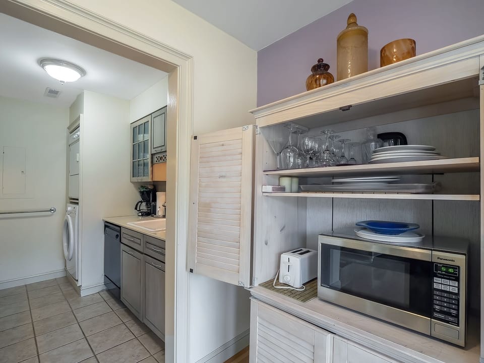 The buffet has a microwave and toaster, freeing up the kitchen counter.  Extra storage is in the buffet.