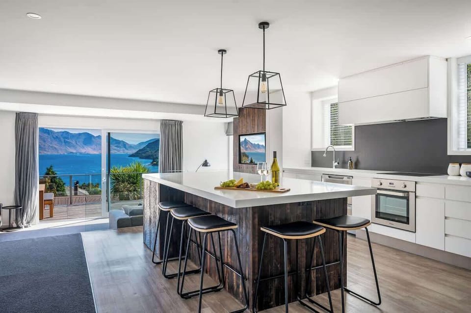 Stylish and functional kitchen in your Queenstown holiday home—includes coffee machine and everything you need to dine in.