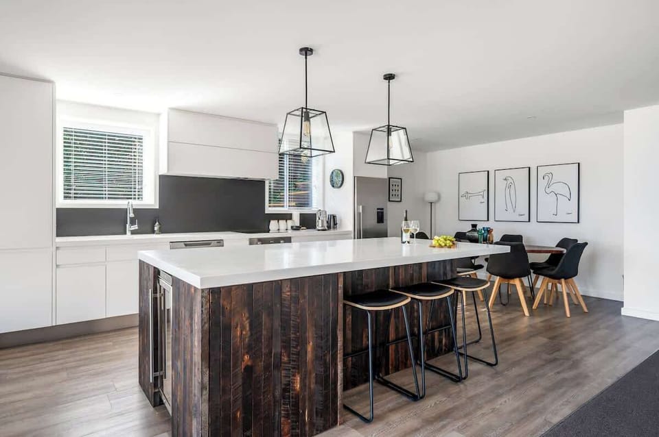 Cook up a storm in this fully equipped Queenstown kitchen featuring a coffee machine, modern appliances, and alpine views.