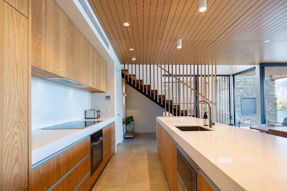 Gourmet Kitchen with Nespresso – This fully equipped kitchen features top-of-the-line appliances, including a Nespresso machine, perfect for enjoying fresh coffee while admiring the scenic views.