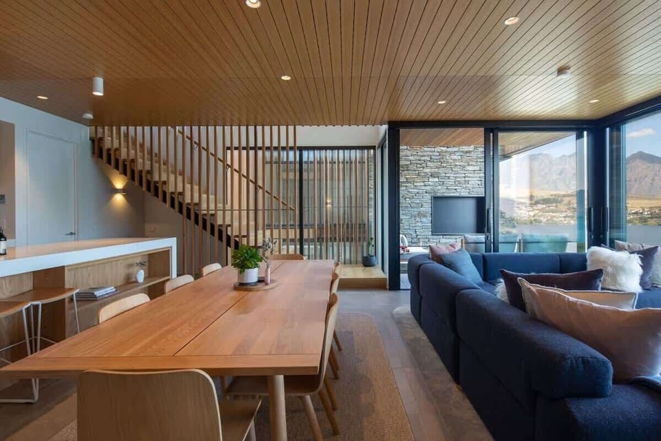 Elegant Dining Area with Lake Views – Dine in luxury at this stylish table, perfectly positioned to enjoy breathtaking views of the lake while sharing meals with loved ones.