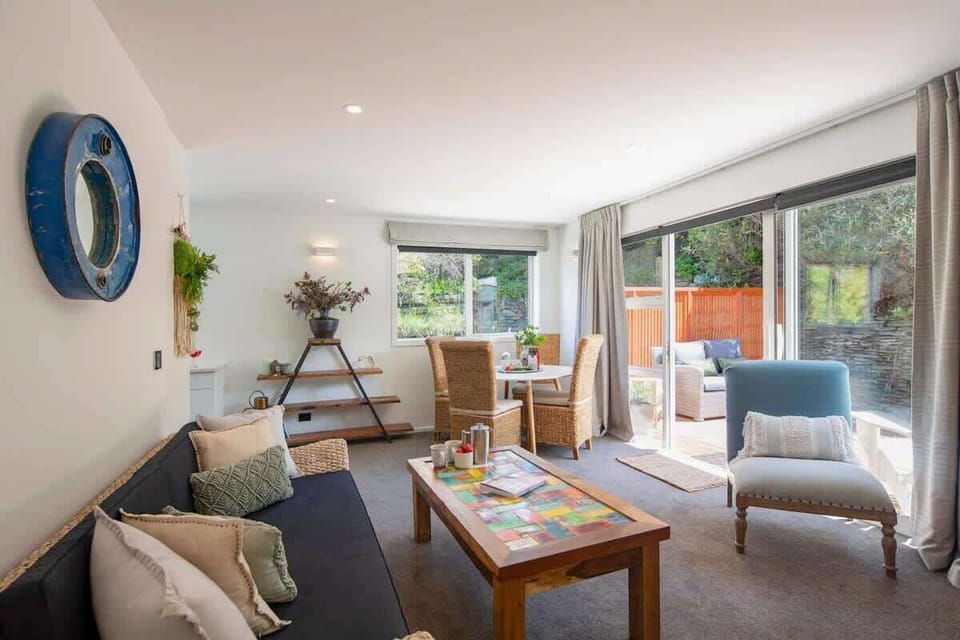 Bright Living Room with AV System and Patio Access
This inviting living room comes with a smart TV, Netflix, and Sonos Playbar. Step through the patio doors to enjoy the outdoors, offering a perfect blend of indoor relaxation and outdoor enjoyment.
