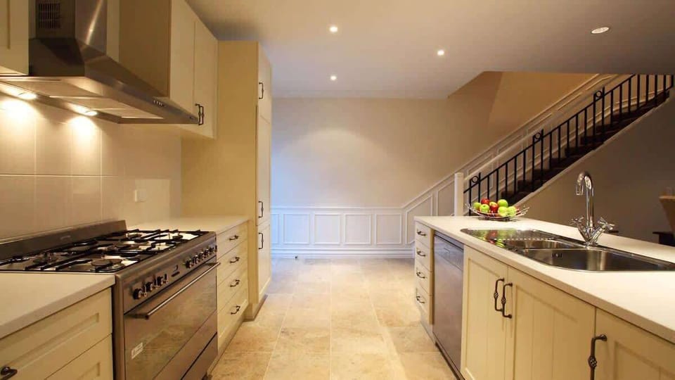Functional and Stylish Kitchen
Enjoy the convenience of a contemporary kitchen, complete with modern appliances and ample space, perfect for cooking and entertaining in your lakeside townhouse.
