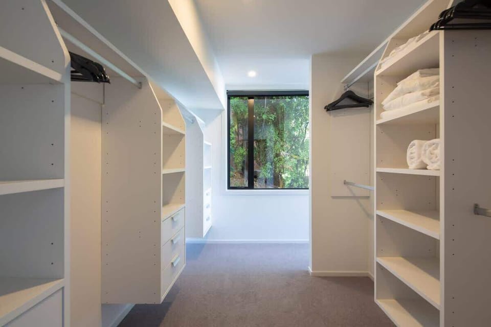Tranquil Bedroom with Ensuite & Views
This beautiful bedroom offers a walk-in wardrobe, private ensuite, and a relaxing bathtub. With stunning views of the lake and mountains, it’s a peaceful sanctuary designed for luxury and relaxation.