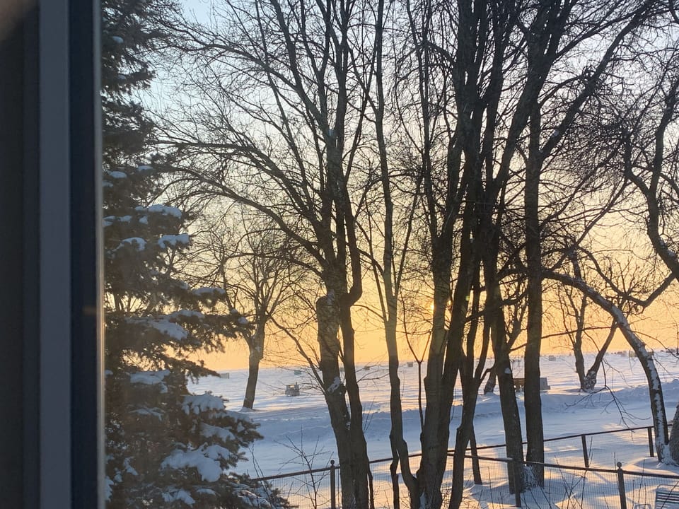 Ice fishing village out front of cottage on our lake.  