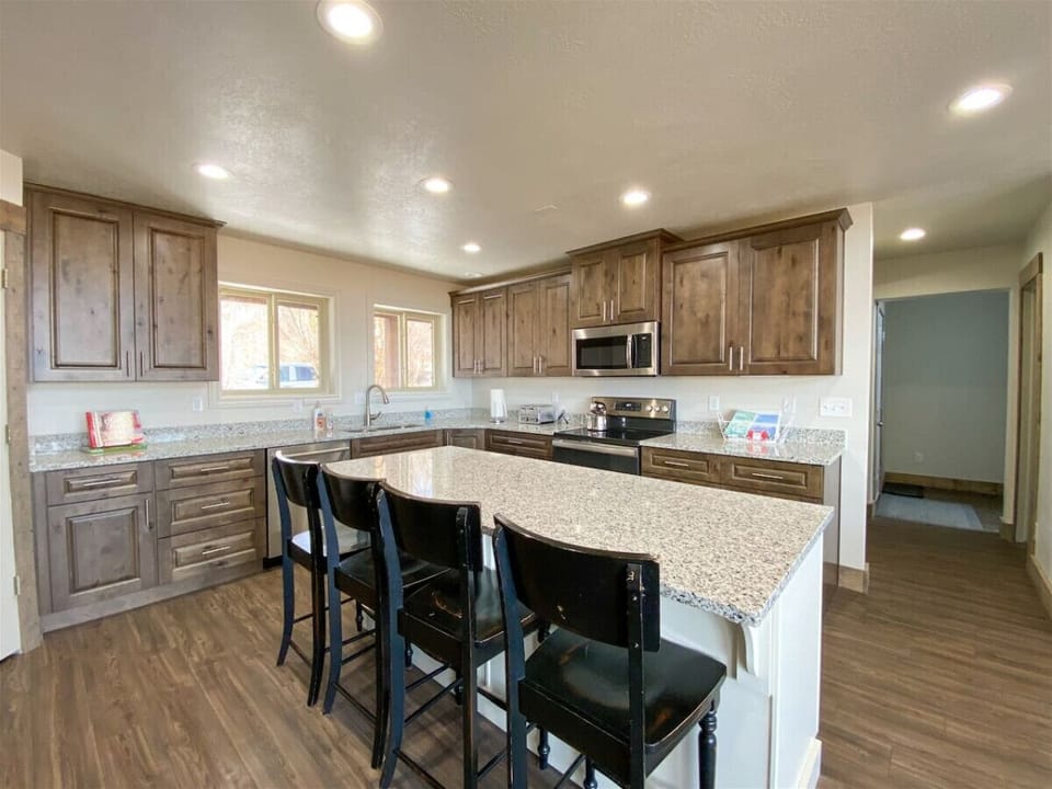 Rustic charm meets modern comfort in this spacious kitchen, perfect for meals and memories.