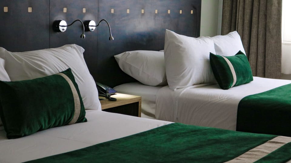 Standard Twin Room | Minibar, in-room safe, desk, blackout drapes
