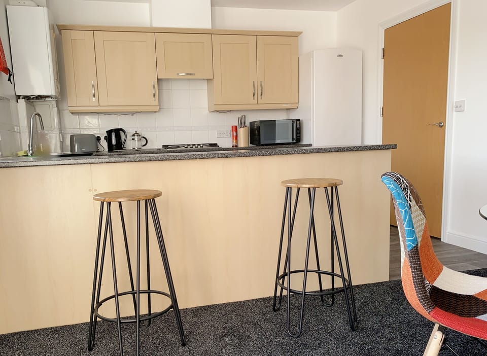 Comfort Apartment | Private kitchen | Full-size fridge, microwave, oven, stovetop