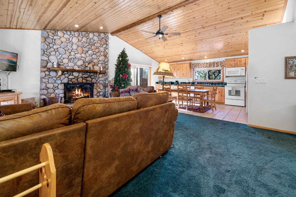 Living Room. - Adorable Living Room with plenty of comfy seating, a fireplace and a Flat screen TV!