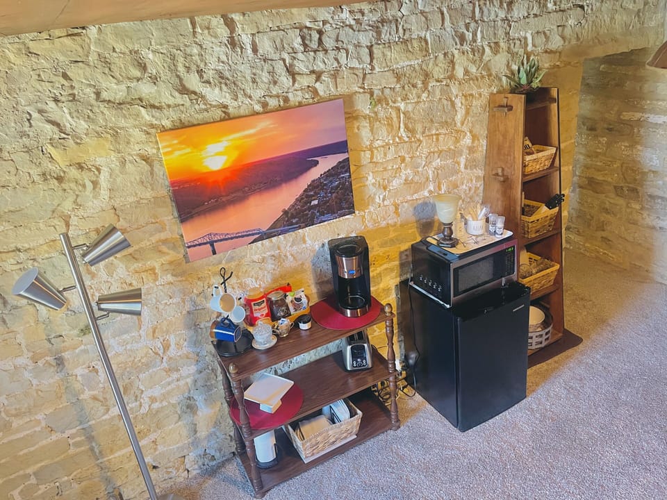 Efficiency area with fridge, microwave, toaster, coffeemaker and snacks! 