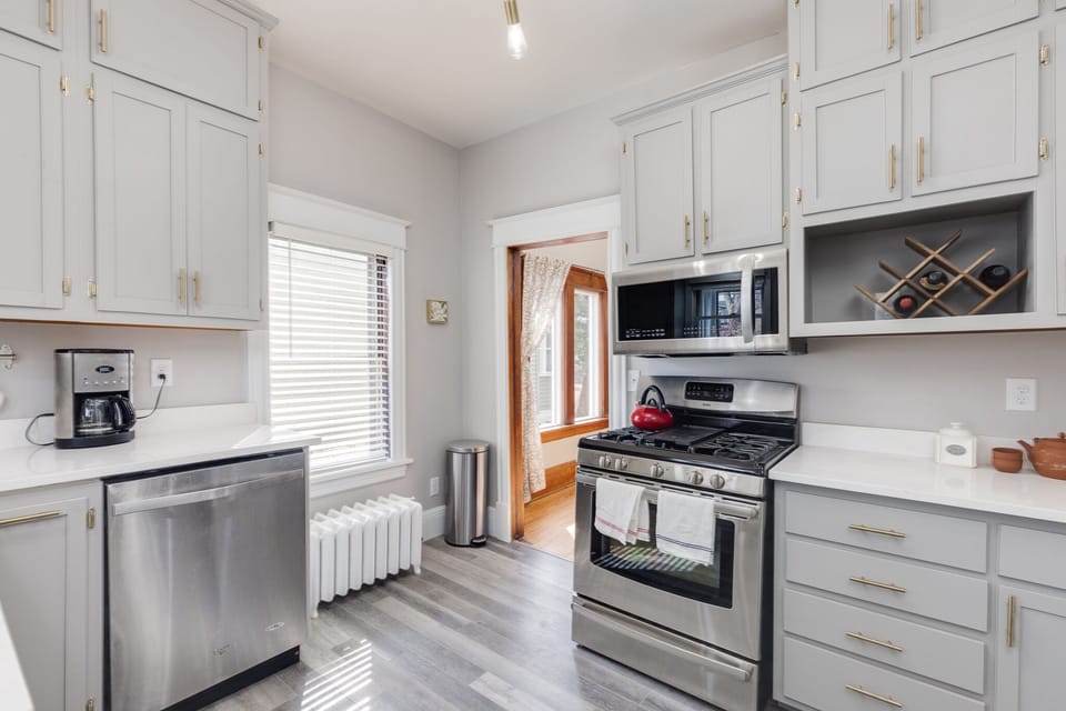 Kitchen is newly remodeled with quartz counter tops, new appliances, coffee and 