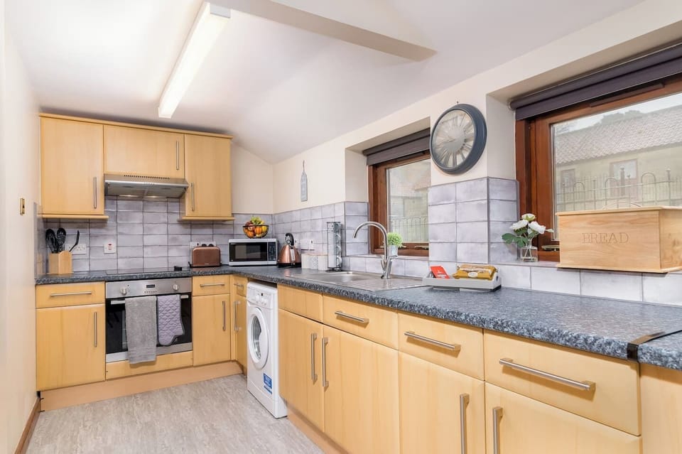  A modern kitchen stocked with all the essentials for cooking up a delicious meal at home.