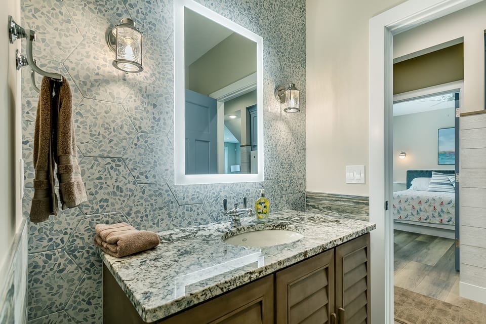 Main Level Bathroom w/ shower. Adjacent to King Bedroom #1. 