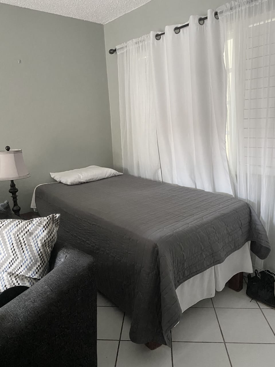 Single bed in living room 