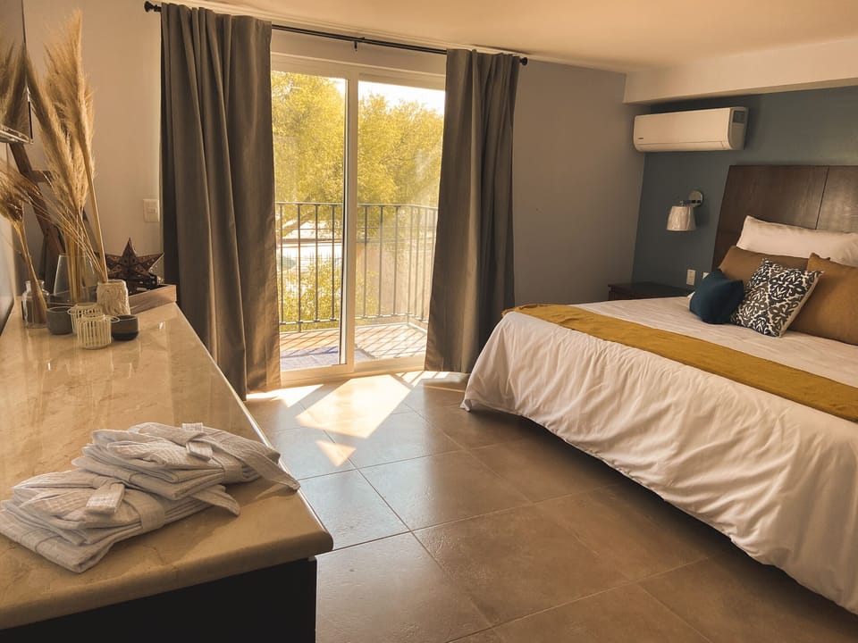 Superior Suite, 1 King Bed, Refrigerator | Minibar, desk, laptop workspace, blackout drapes