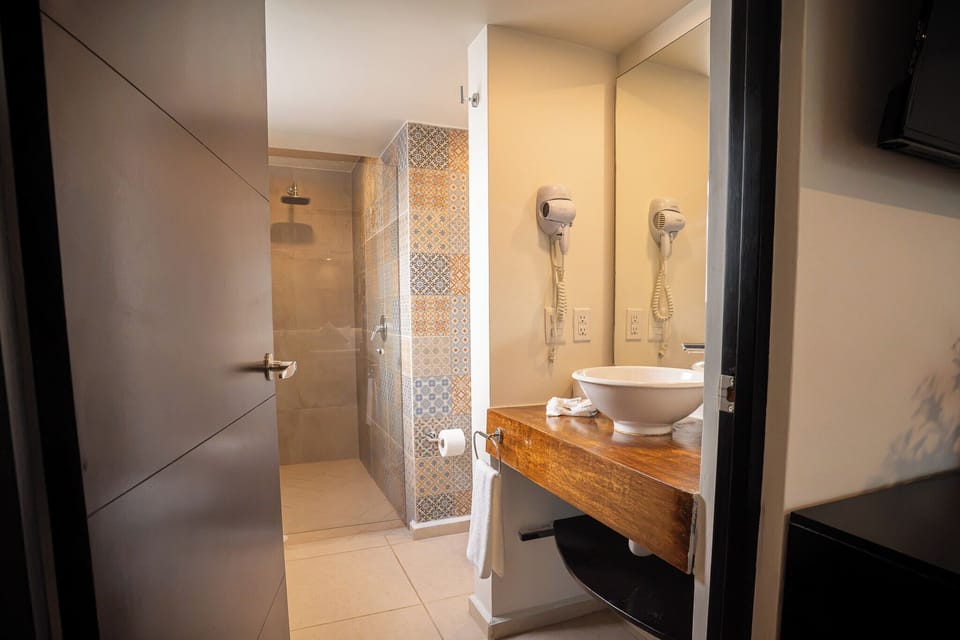 Standard Double Room, 2 Queen Beds | Living room | 42-inch flat-screen TV with cable channels, TV