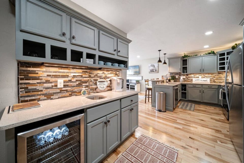 The wet bar is stocked with a selection of tea, coffee, and water!