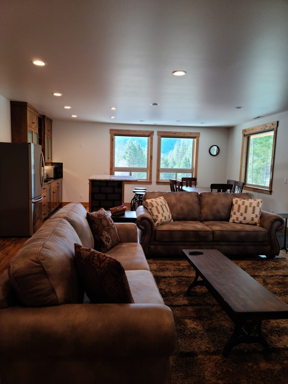 Living room looking toward dining and kitchen area.  Country views.