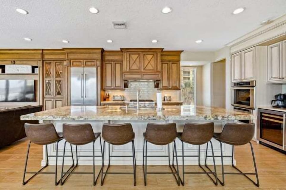 Large island with bar seating, perfect for dining and gathering.