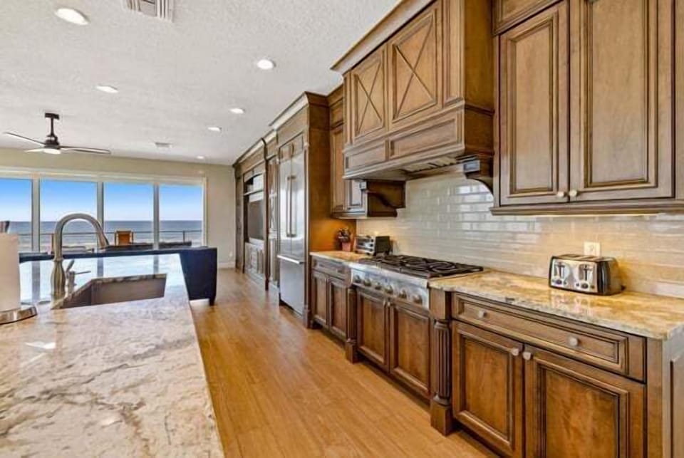 Spacious gourmet kitchen designed for cooking, gathering, and enjoying the coastal scenery