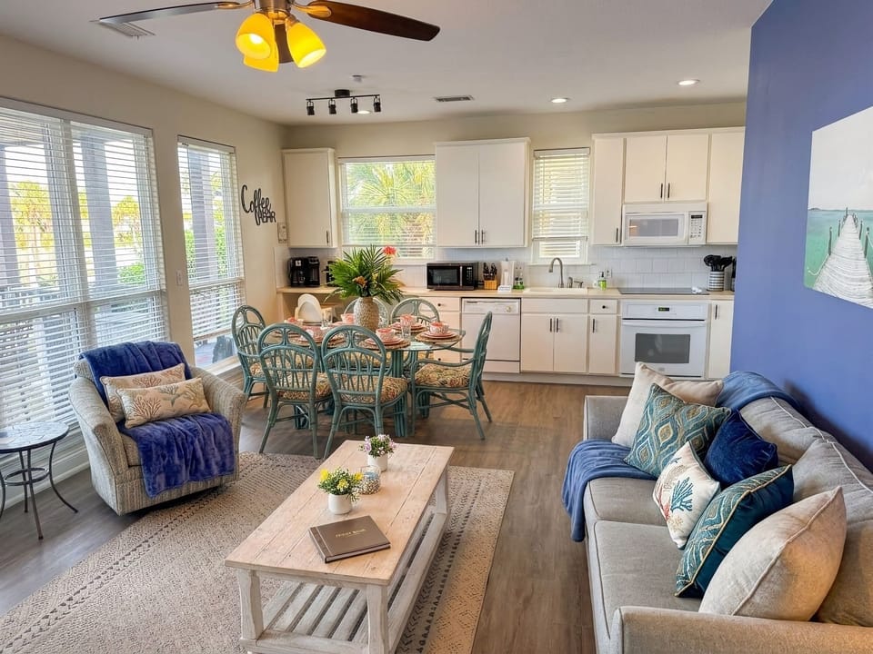 A virtual "wall of windows" offers water views from the kitchen, dining, and living areas in Margarita Villa B.