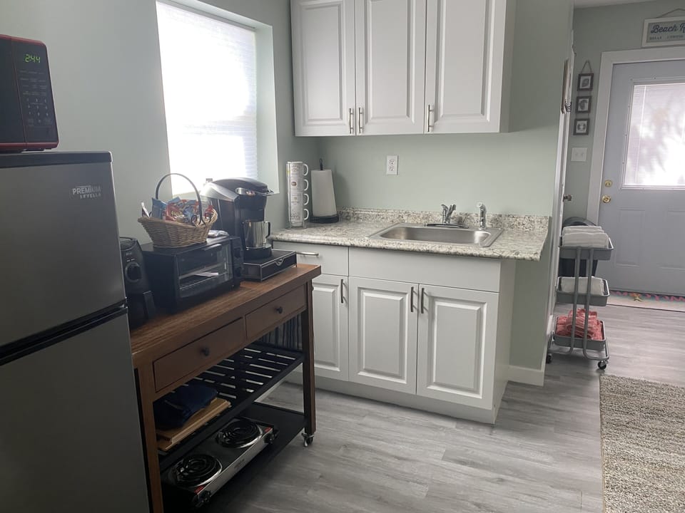 View kitchenette -microwave/medium fridge/toaster oven/stove top burners 