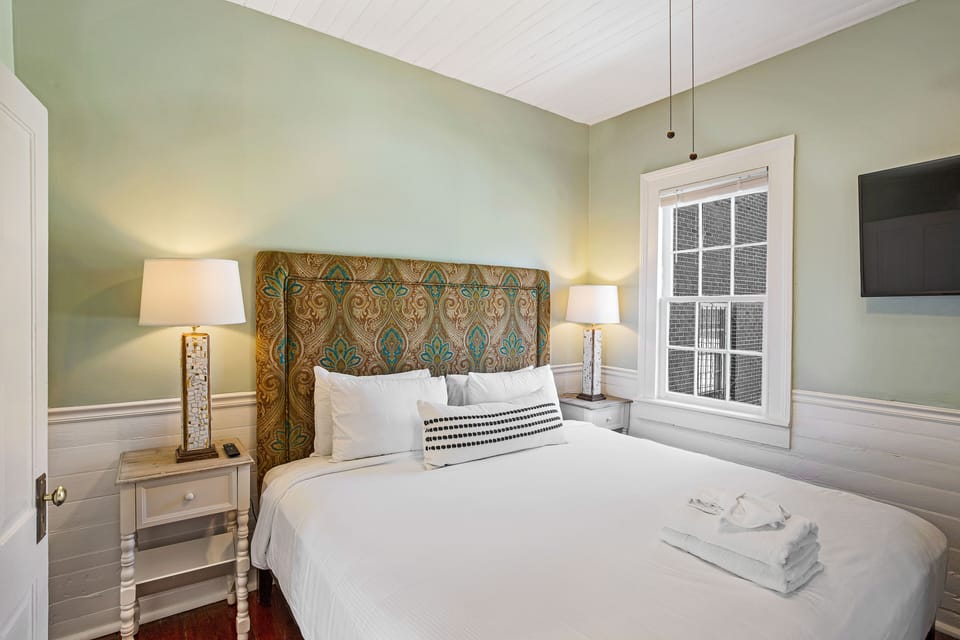 Heading across the hall, you'll find the fourth bedroom.