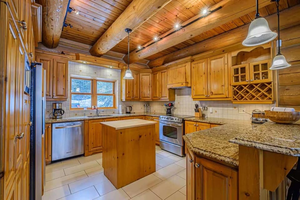 Fully equipped kitchen with granite countertops and modern appliances