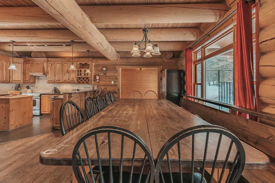 Rustic dining room with long table and natural wood finishes
